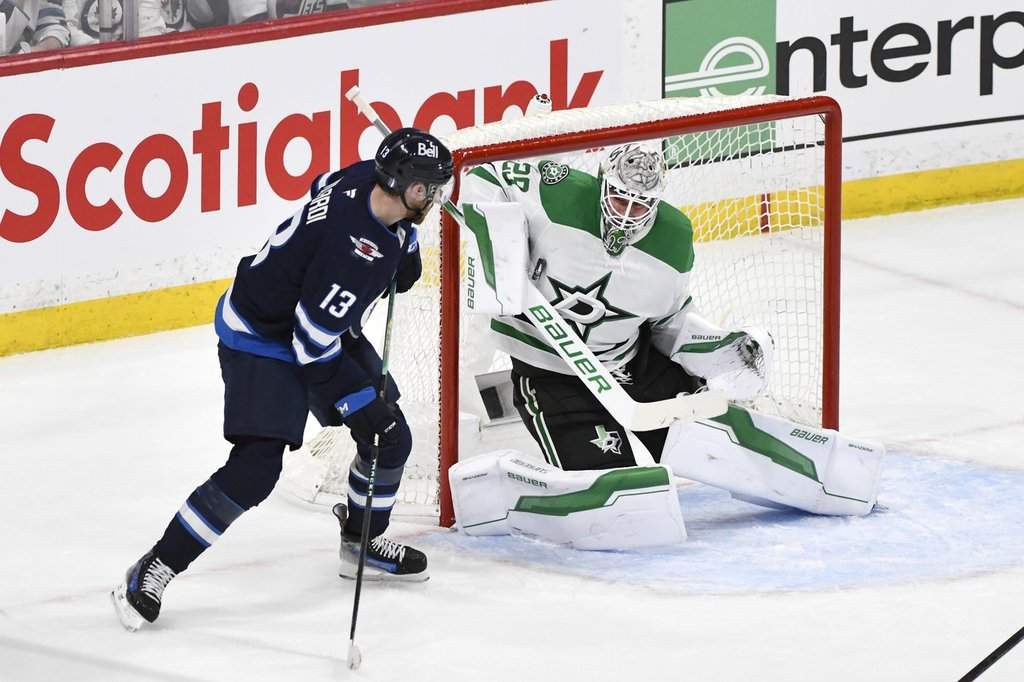 Dallas Stars goaltender Jake Oettinger (29) makes a save on Winnipeg Jets' Gabriel Vilardi (13) during first period NHL playoff hockey action in Winnipeg, Wednesday, May 7, 2025. THE CANADIAN PRESS/Fred Greenslade.