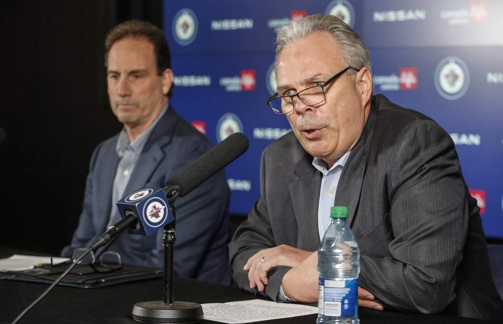 Winnipeg Jets general manager Kevin Cheveldayoff, right, and head coach Scott Arniel speak to media at a press conference in Winnipeg, on May 27, 2024. THE CANADIAN PRESS/John Woods.