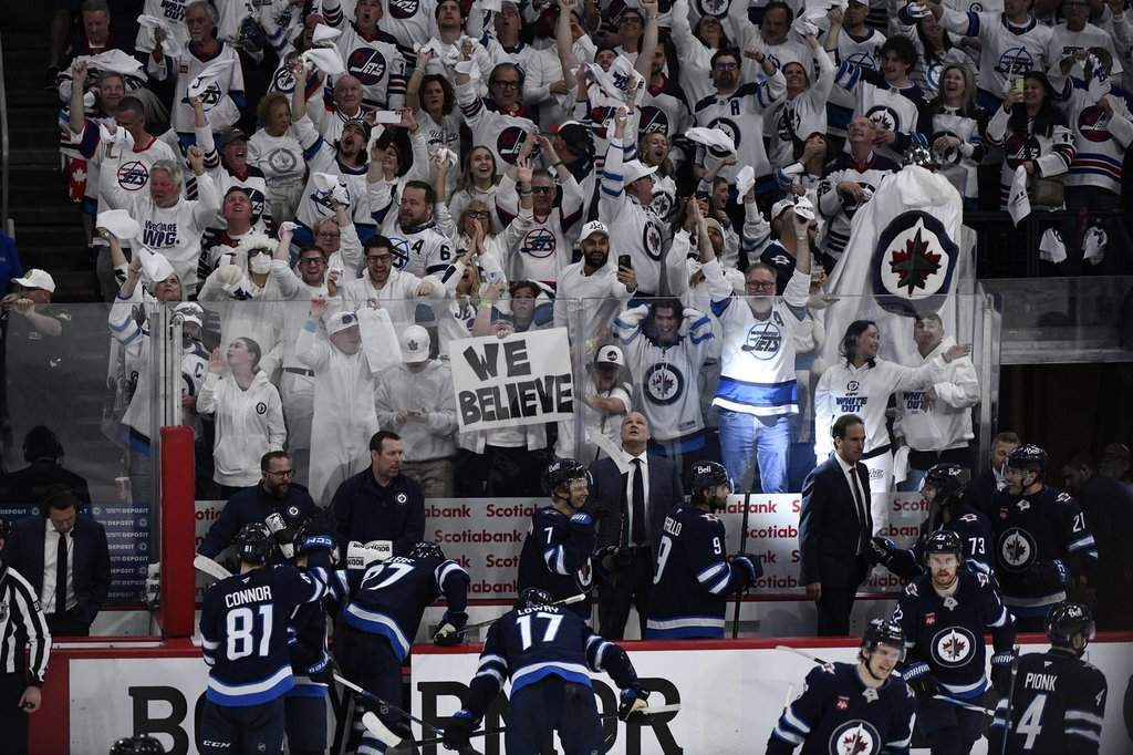 Winnipeg Jets fans celebrate the Jets third goal against the St. Louis Blues during third period NHL round one, game seven Stanley Cup playoff action in Winnipeg, Sunday May 4, 2025. THE CANADIAN PRESS/Fred Greenslade.