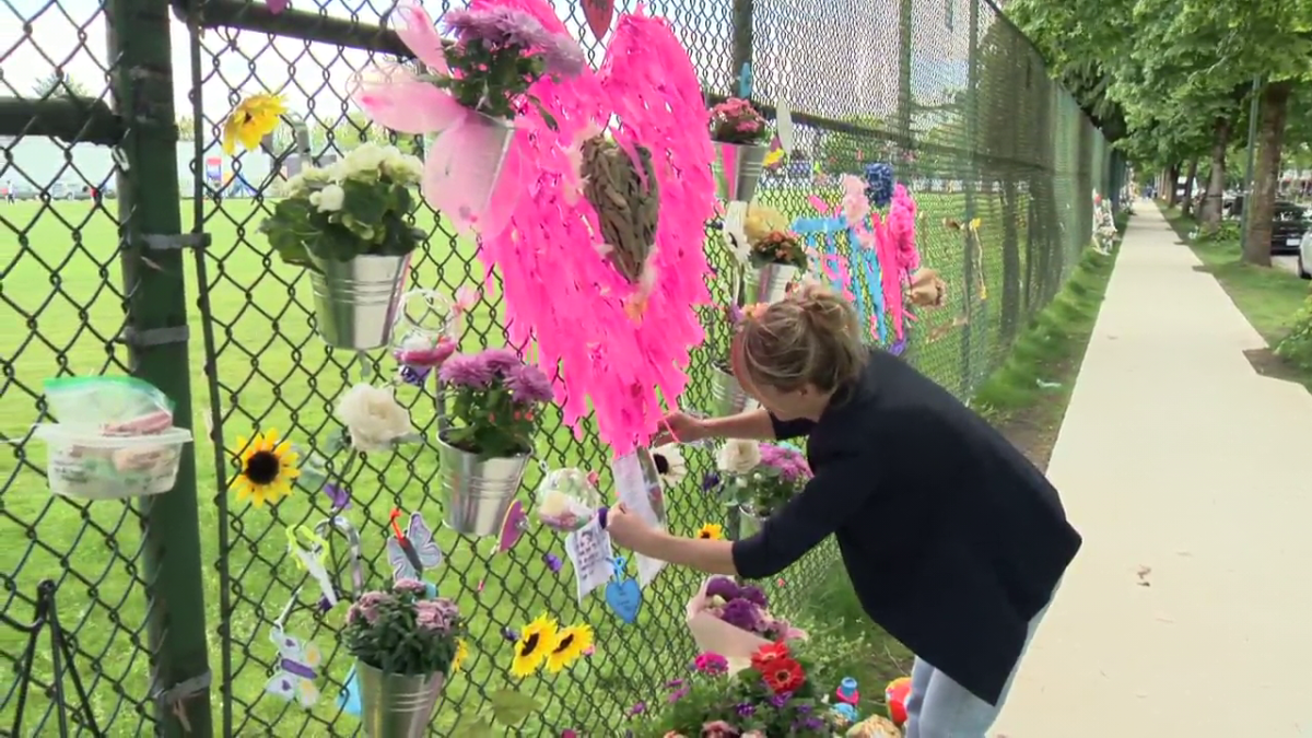 Libby Rowe adds to a memorial she helpd build to her friend Jennifer Darbellay who was killed in the Lapu Lapu Day attack.