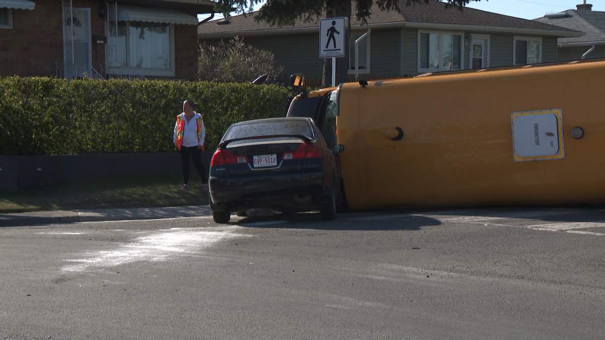 A Calgary school bus was flipped onto its side after being involved in a crash with another vehicle on Tuesday morning.