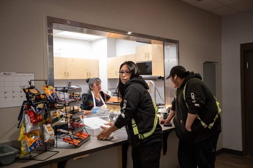 Workers stop for lunch at the arena, one of many amenities and infrastructure projects the Indigenous community of 700 in the oilsands region has been able to finance through relationship with industry, in Fort McKay, Alta., on Thursday April 25, 2024.