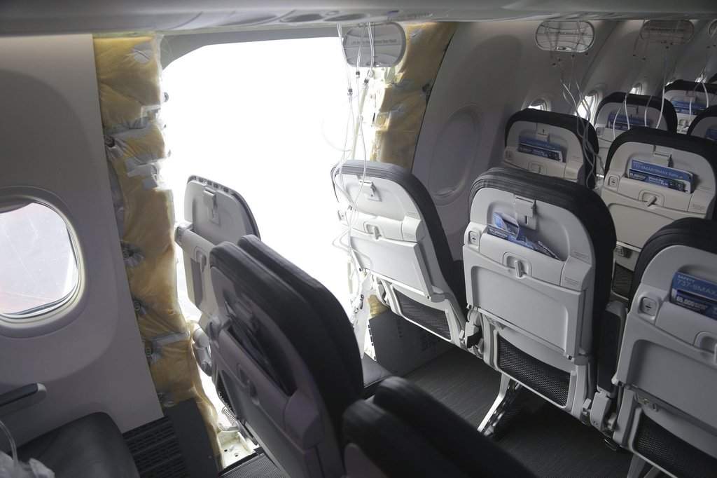FILE - This image taken Jan. 7, 2024, and released by the National Transportation Safety Board, shows the section of a a Boeing 737 Max where a door plug fell while Alaska Airlines Flight 1282 was in flight.