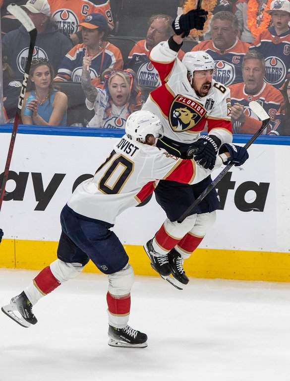 Florida Panthers winger Brad Marchand (63) celebrates his game-winning goal against the Oilers with Jesper Boqvist (70) during the second overtime period in Game 2 of the Stanley Cup final in Edmonton on Friday, June 6, 2025.