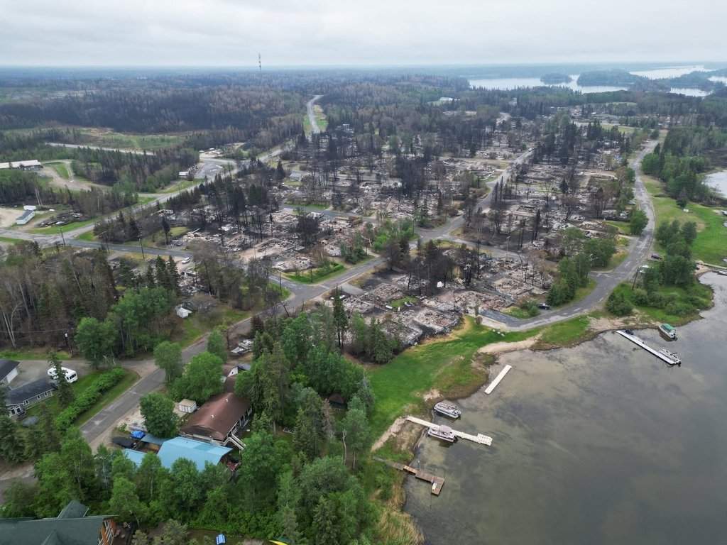 Denare Beach, Sask., is seen from the air in a June 21, 2025, handout photo. Homes destroyed by a recent wildfire are seen in the centre-right. The Saskatchewan Public Safety Agency has said 218 personal residences were lost to the blaze in early June. THE CANADIAN PRESS/Handout - Will Penner (Mandatory Credit)