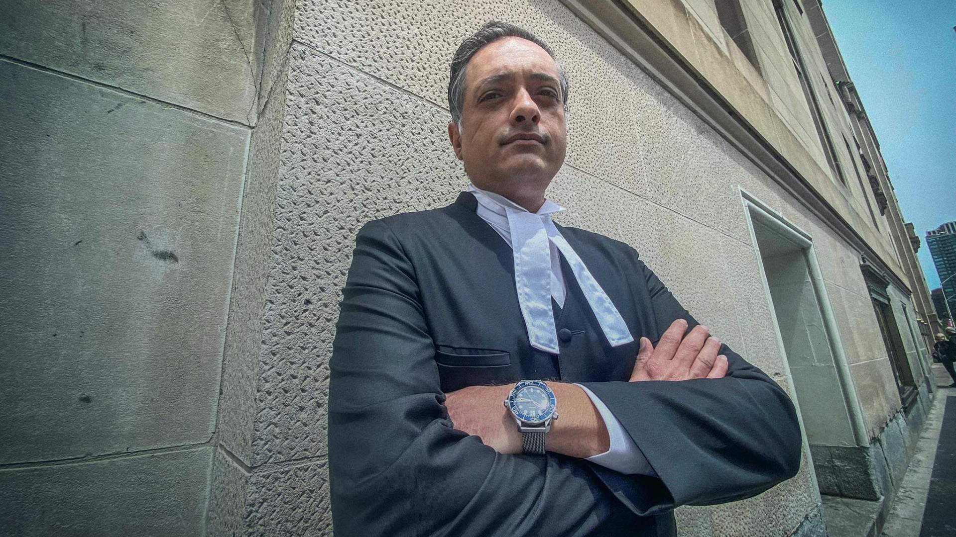 Photo of Victoria lawyer Umar SheikH in courtroom robes