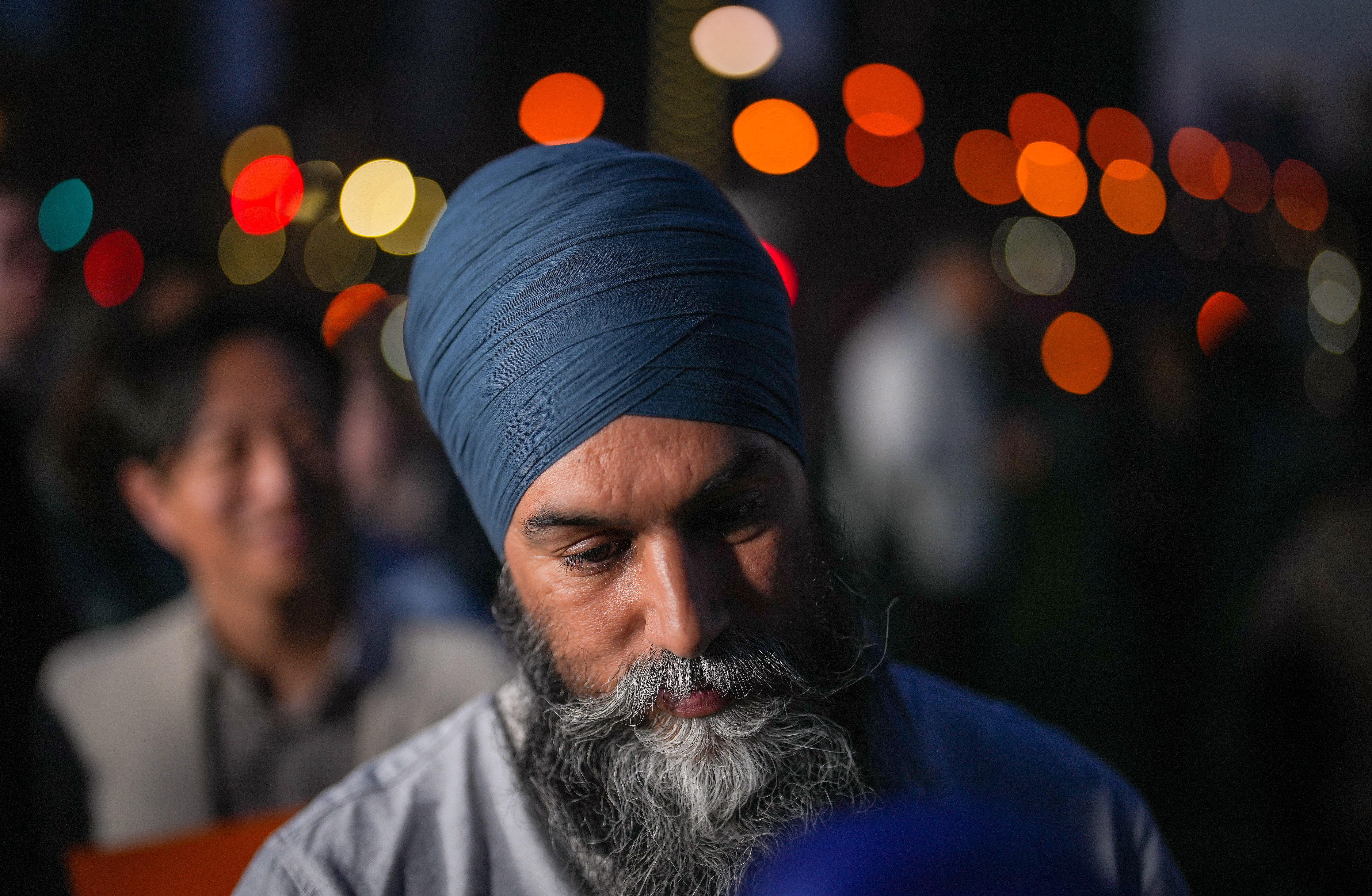 NDP Leader Jagmeet Singh listens to supporter after campaign rally, Toronto, April 24, 2025. THE CANADIAN PRESS/Darryl Dyck.