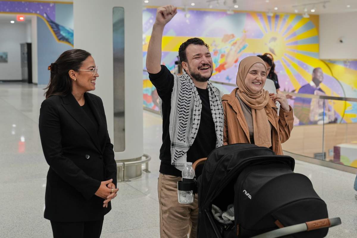 Mahmoud Khalil, left, reacts alongside his wife, Noor Abdalla, right, upon arriving at Newark International Airport, Saturday, June 21, 2025, in Newark, N.J.