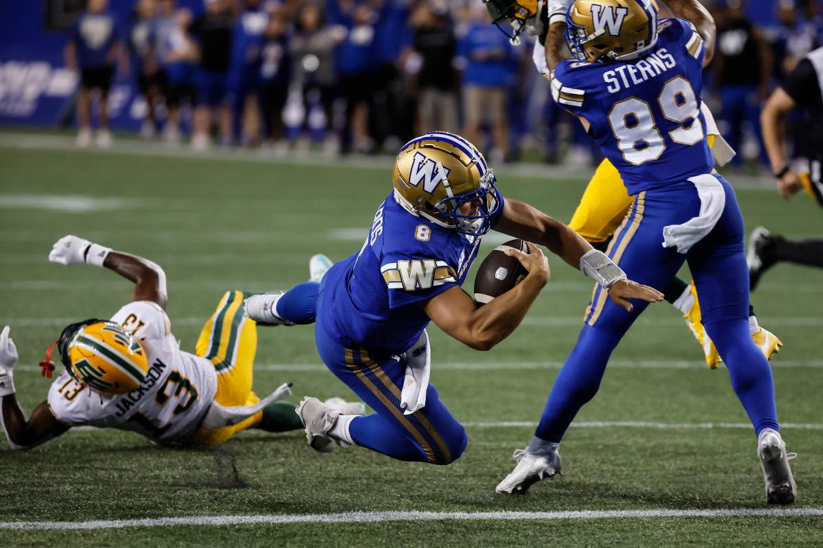 Winnipeg Blue Bombers quarterback Zach Collaros (8) dives across the line for the touchdown against the Edmonton Elks during second half CFL action in Winnipeg Thursday, June 26, 2025.