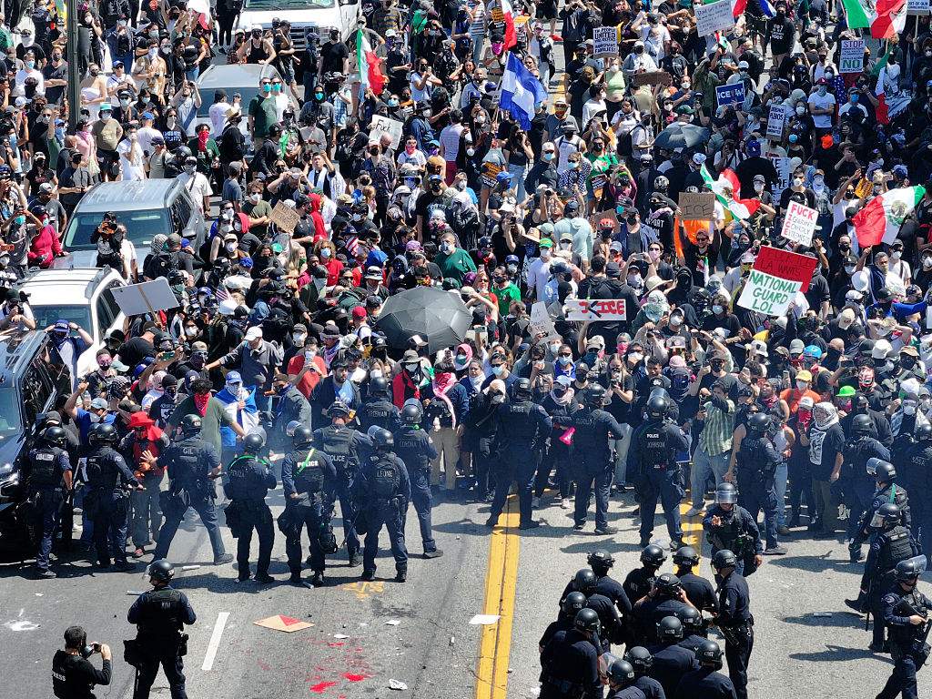 Hundreds of protesters gather to demand an immediate end to Immigration and Customs Enforcement workplace raids in Los Angeles, Calif., on June 8, 2025.