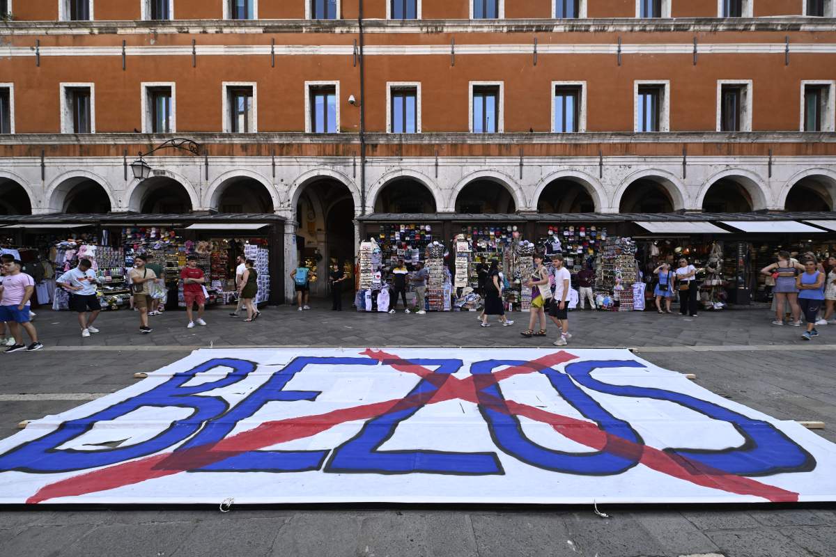 People gather to protest against the wedding of Amazon Founder and CEO Jeff Bezos and journalist Lauren Sanchez in Venice, on June 13, 2025.