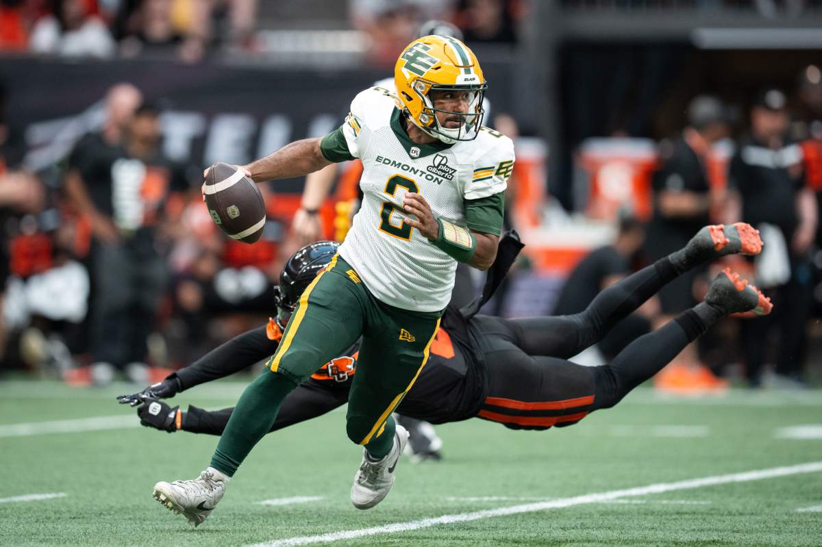 Elks QB Tre Ford escapes pressure from the B.C. Lions in the season-opener on June 7, 2025 in Vancouver.