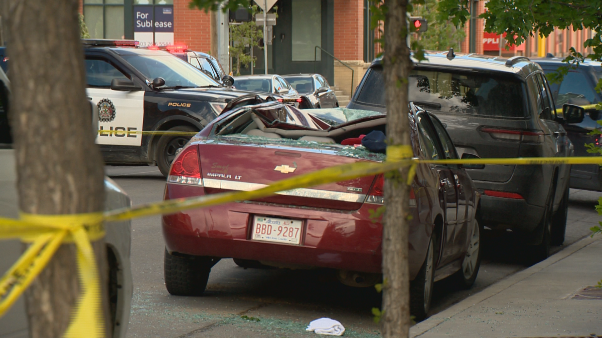 A car with the roof caved in.