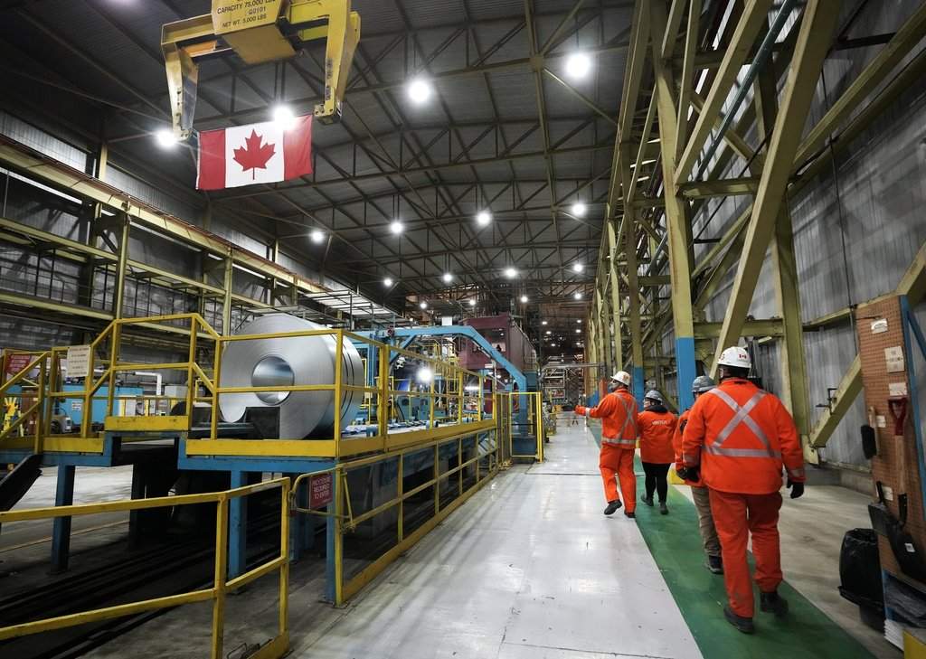 Deloitte Canada expects the Canadian economy will hit a recession in 2025, but may avoid the worst-case outcome. Steel workers work at the ArcelorMittal Dofasco steel plant in Hamilton, Ont., on Wednesday, March 12, 2025. THE CANADIAN PRESS/Nathan Denette.