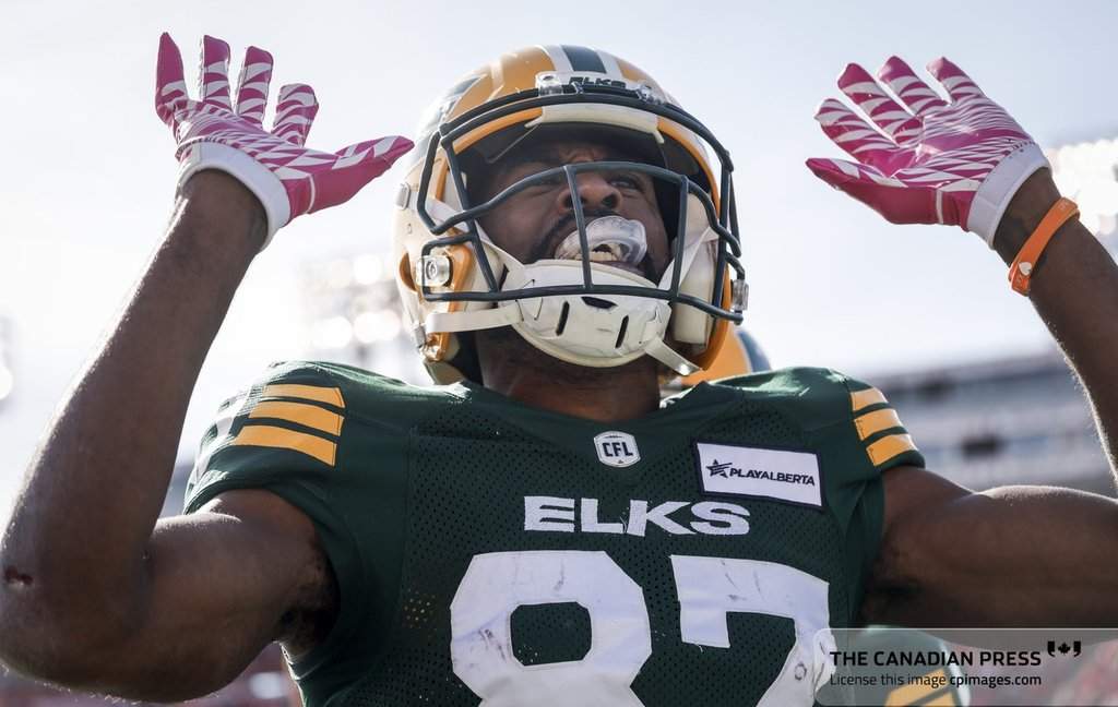 Edmonton Elks' Eugene Lewis celebrates his touchdown during first half CFL football action against the Calgary Stampeders in Calgary, Saturday, Oct. 12, 2024.