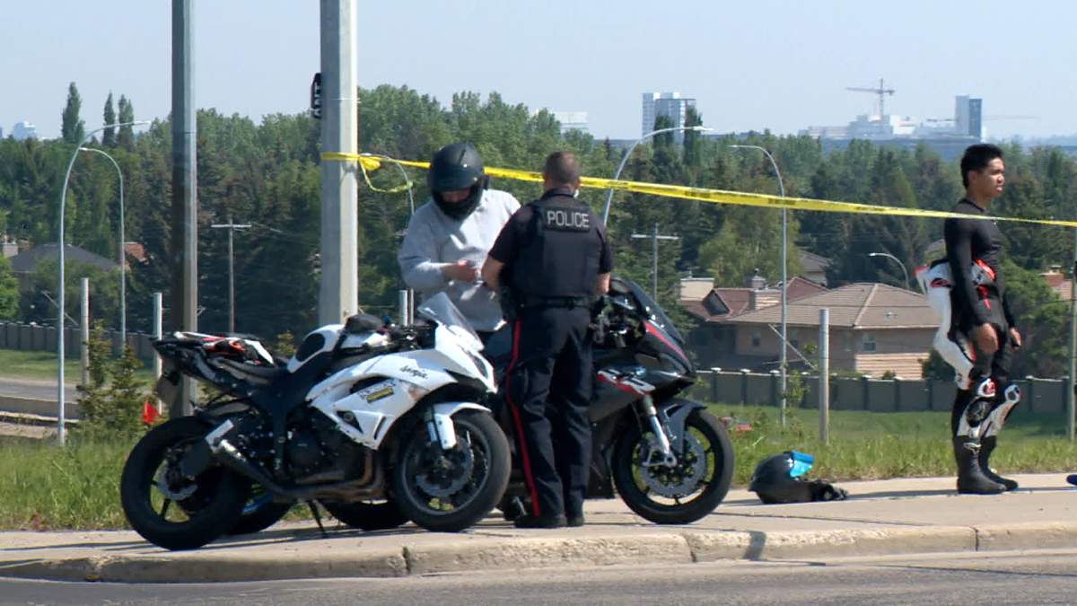 Calgary police investigators could be seen speaking to several motorcycle riders near the scene of a deadly crash in northwest Calgary on Sunday.