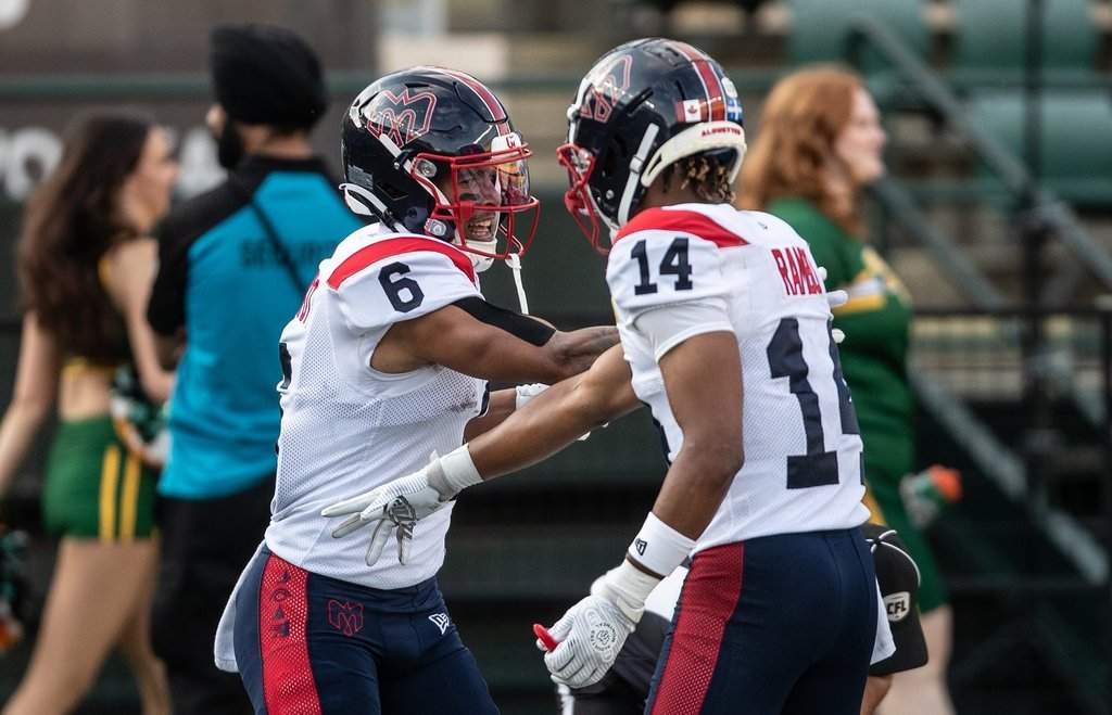 Montreal Alouettes' Tyson Philpot (6) and Charleston Rambo (14) celebrate a touchdown against the Edmonton Elks during first half CFL action in Edmonton, on June 19, 2025.