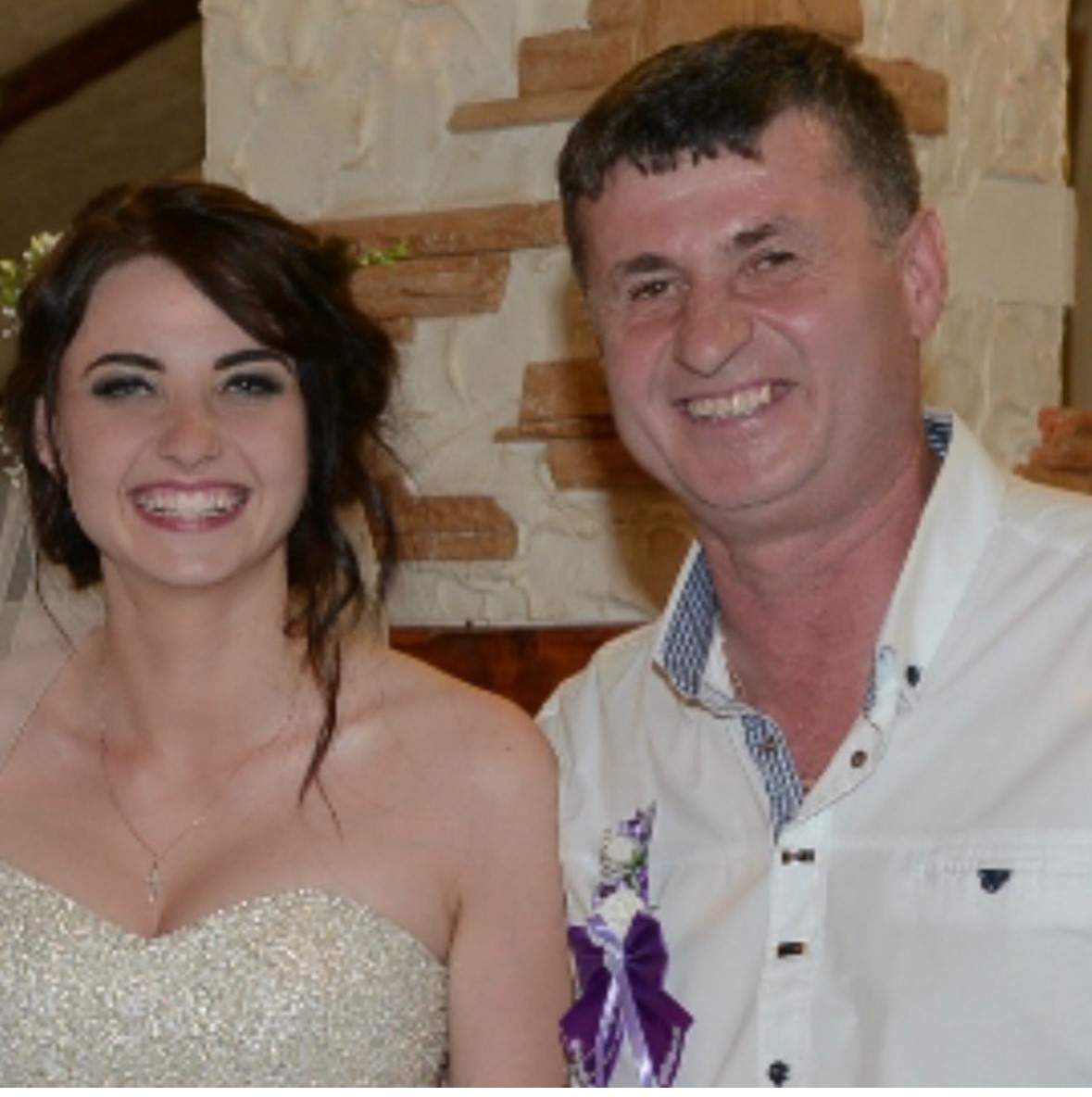 Olha Kulybanych and her father on her wedding day back in Ukraine.