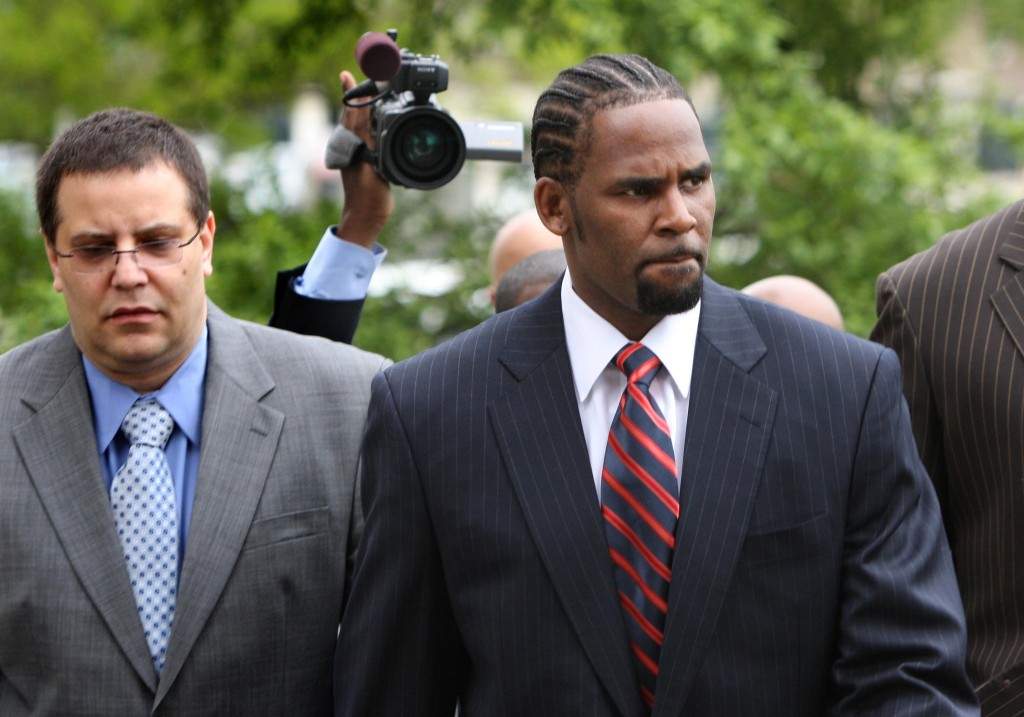 R. Kelly, right, arrives with manager Derrel McDavid at the Cook County Criminal Courts Building for his child pornography trial on May 20, 2008, in Chicago.