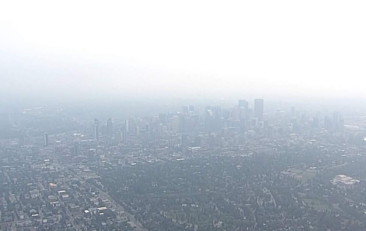The downtown Calgary skyline is obscured by smoke in this shot from the Global News helicopter Wednesday morning.