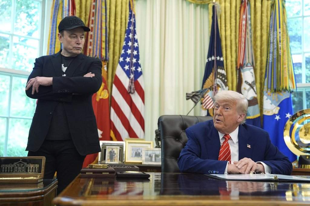 FILE - President Donald Trump, right, speaks during a news conference with Elon Musk in the Oval Office of the White House, Friday, May 30, 2025, in Washington.