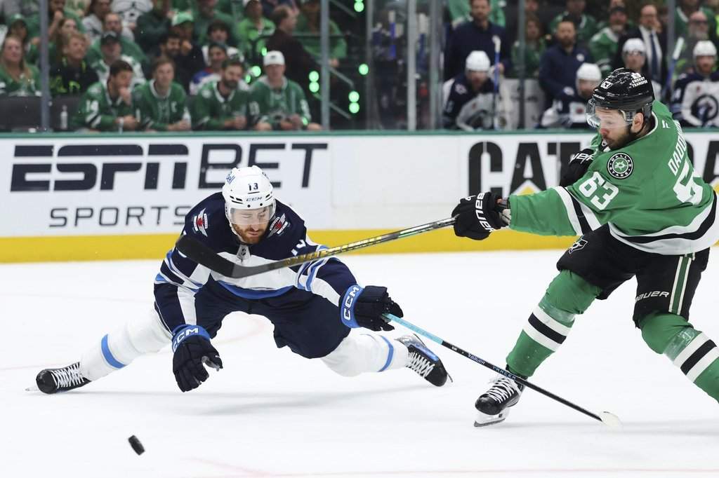 Winnipeg Jets centre Gabriel Vilardi (13) blocks a shot by Dallas Stars' Evgenii Dadonov (63) in the first period of Game 6 of a second-round NHL hockey playoff series in Dallas, Saturday, May 17, 2025. (AP Photo/Gareth Patterson).