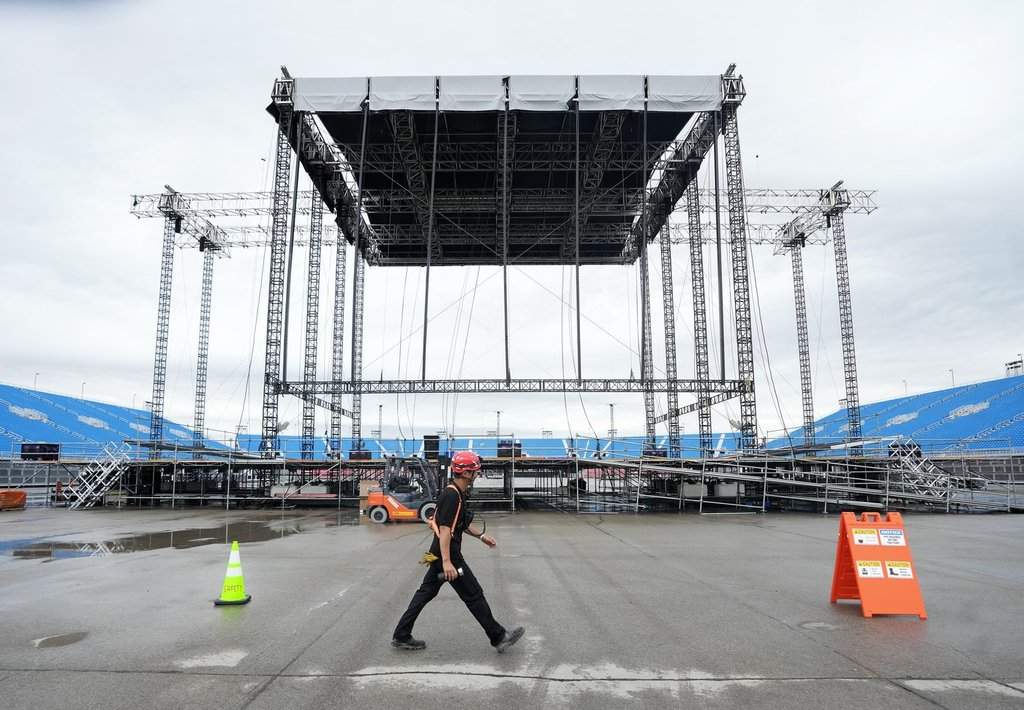 A worker walks past the stage at the brand new 50000 capacity concert venue, Rogers Stadium, in Toronto, Thursday, June 26, 2025. THE CANADIAN PRESS/Nathan Denette