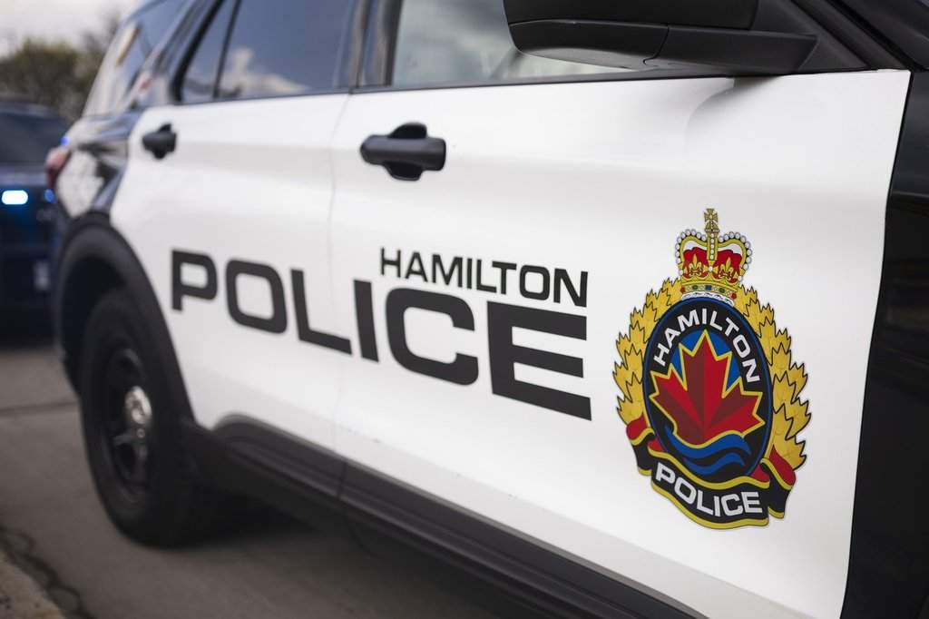 A Hamilton woman is facing charges after allegedly stealing from a Good Samaritan helping at the scene of a fatal downtown shooting on July 11.