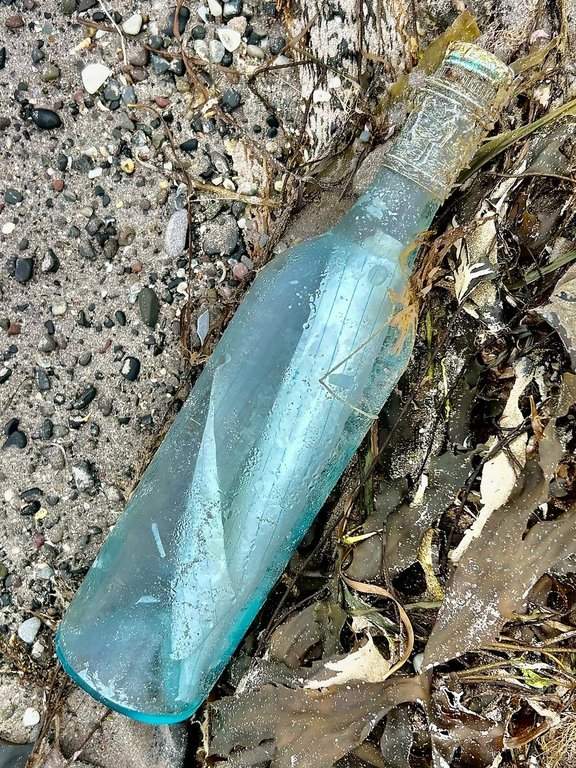 A bottle containing a note from a Newfoundland couple is shown on a beach in southwestern Ireland on July 7, 2025. 
THE CANADIAN PRESS/Handout - Kate Gay
 (Mandatory Credit).
