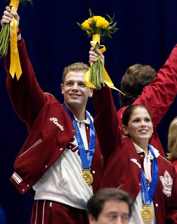 Canada’s Jamie Sale and David Pelletier wave to the crowd after receiving their gold medals for the pairs ice dance at the XIX Olympic Winter Games in Salt Lake City, Utah, Sunday, Feb. 17, 2002. The gold medal was also awarded to the Canadian pair following a controversy in the judging of the competition. (CP PHOTO/Tom Hanson)