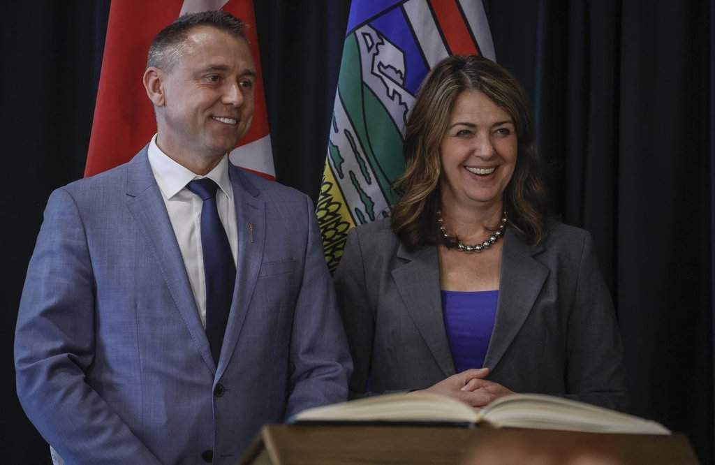 Alberta Premier Danielle Smith, right, stands with new Minister of Tourism and Sport, Andrew Boitchenko, following a swearing in ceremony in Calgary, Alta., on May 16, 2025. THE CANADIAN PRESS/Jeff McIntosh.