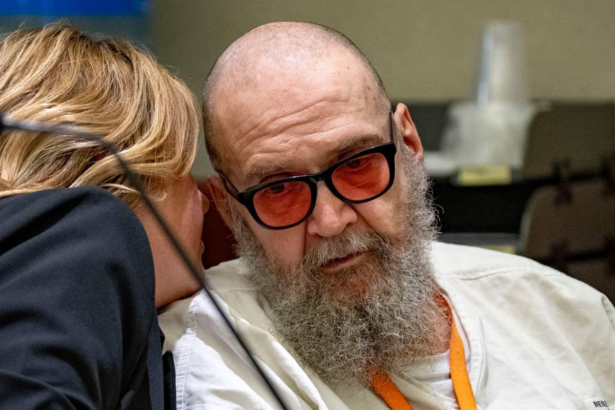 Jasmine North, Federal Public Defender Mitigation Investigator, speaks with Ralph Leroy Menzies, during his competency hearing in Third District Court in West Jordan, on Monday, Nov 18, 2024.