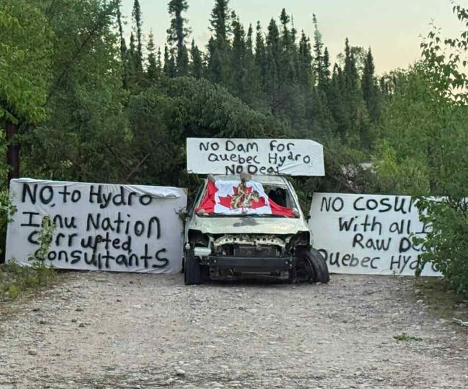 Signs are shown in this handout photo at the site of a tentatively planned hydroelectric development at Gull Island in Labrador on Wednesday, July 9, 2025. Quebec's hydro utility says it has suspended work at the site amid protests by some residents. 