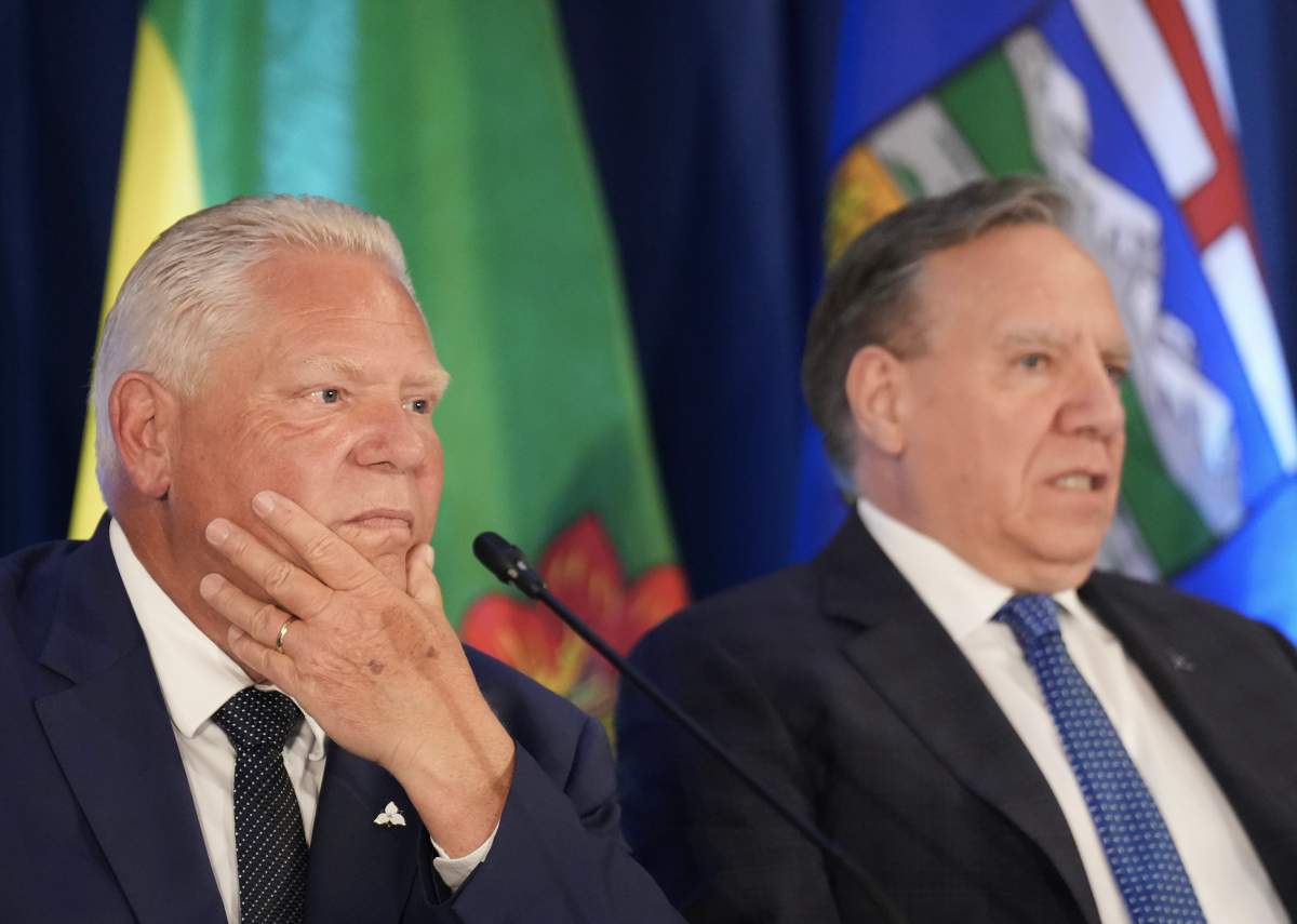 Ontario Premier Doug Ford, left, and Quebec Premier Francois Legault listen to questions from the media during the 2025 summer meetings of Canada’s Premiers at Deerhurst Resort in Huntsville, Ont., on Wednesday, July 23, 2025.
