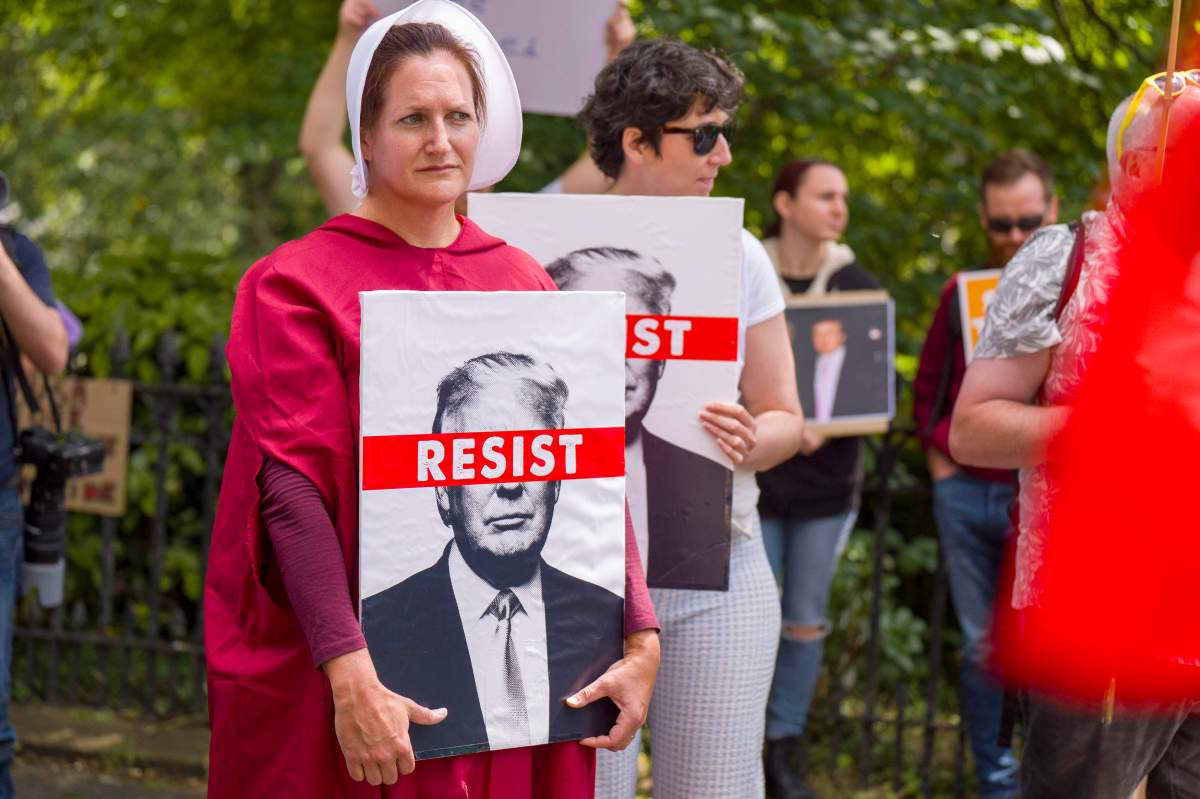 People take part in a Stop Trump Scotland protest outside the U.S. Consulate in Edinburgh, as U.S. President Donald Trump begins his five-day private trip to the country at his Turnberry golf course in South Ayrshire on Saturday July 26, 2025. (Jane Barlow /PA via AP)
