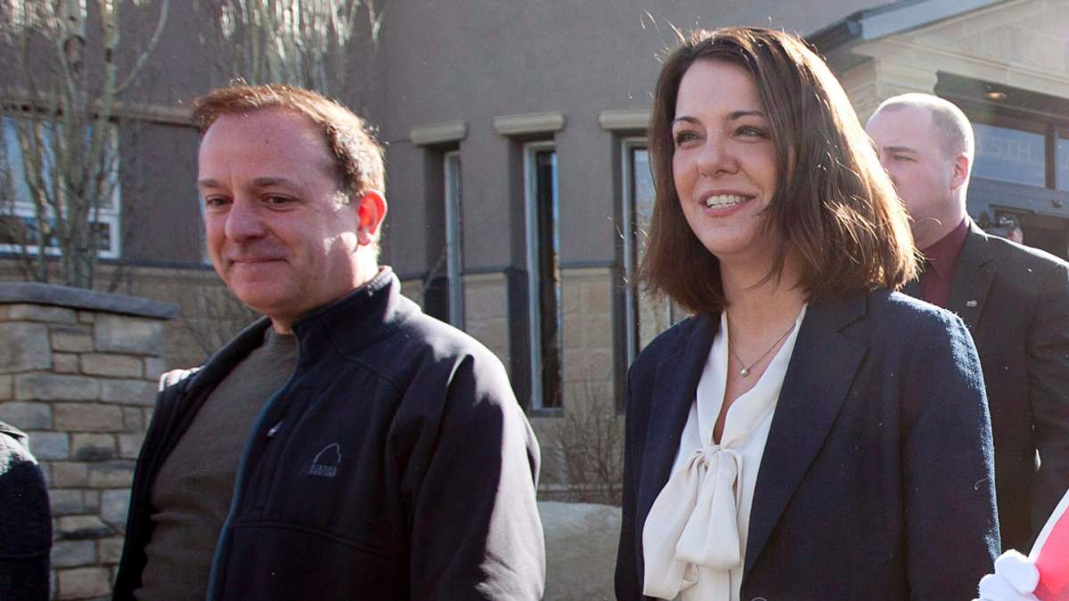 Then-Wildrose Leader Danielle Smith leaves a polling station with her husband David Moretta, left, in High River, Alberta to cast her ballot for the Alberta election Monday, April, 23, 2012. 
