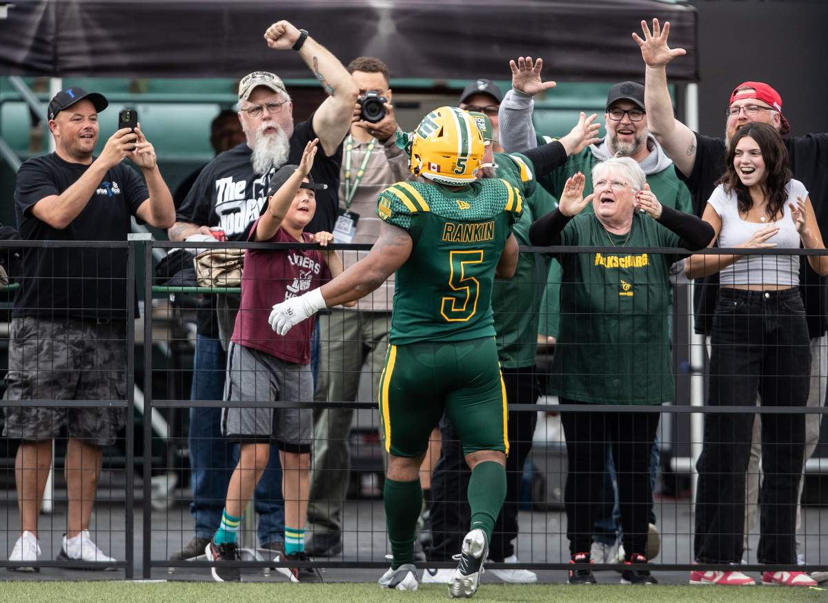 Edmonton Elks running back Justin Rankin celebrates with fans after a touchdown against the Ottawa Redblacks on Sunday, July 13, 2025