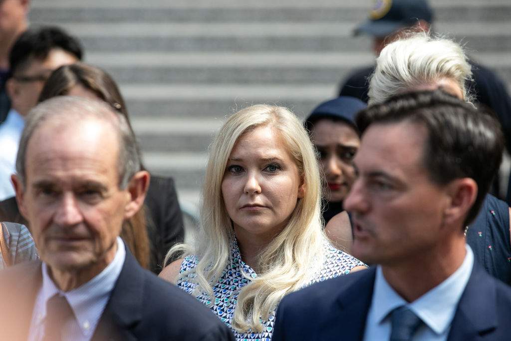 Virginia Giuffre, an alleged victim of Jeffrey Epstein, center, exits from federal court in New York, U.S., on Tuesday, Aug. 27, 2019.