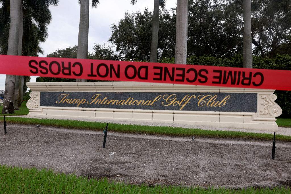 Crime scene tape marks off the area as law enforcement personnel continue to investigate the area where the Secret Service discovered a would-be assassin of former President Donald Trump at the Trump International Golf Club on September 17, 2024, in West Palm Beach, Florida. The FBI and U.S. Secret Service, along with the Palm Beach County Sheriff's office, are investigating the incident, which the FBI said "appears to be an attempted assassination of former President Trump" while he was golfing at Trump International Golf Club.