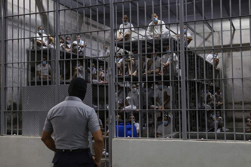 A prison officer guarding gang members in a cell at the Terrorism Confinement Center (CECOT) in Tecoluca, in San Vicente, El Salvador on April 04, 2025.