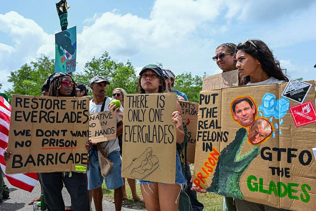 Demonstrators protest the construction of an immigrant detention center, dubbed "Alligator Alcatraz," in the Everglades near Ochopee, Florida, on June 28, 2025.
