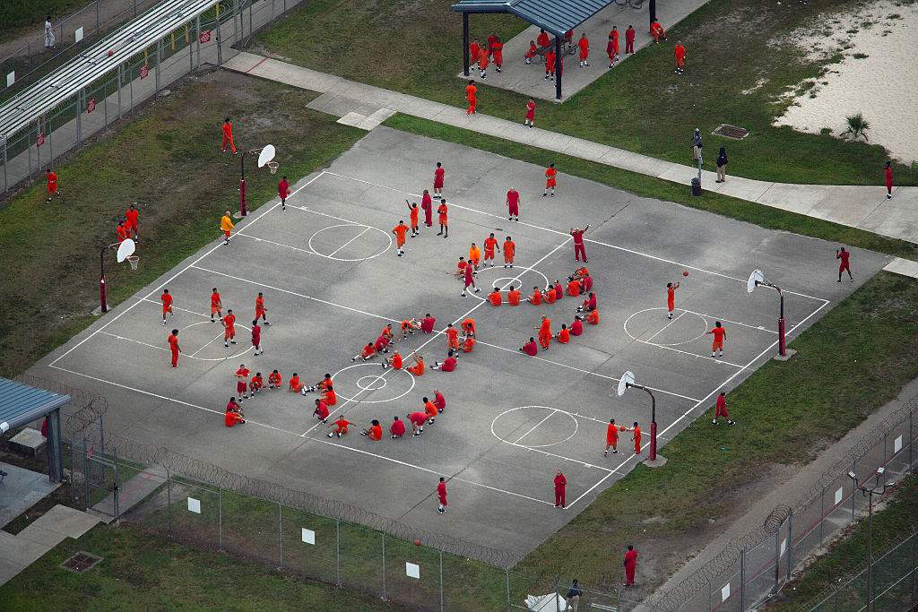 In an aerial view from a helicopter, detainees are seen at Krome Detention Center run by United States Immigration and Customs Enforcement on July 4, 2025 in Miami, Florida. U.S. President Donald Trump was present at the opening of the nearby "Alligator Alcatraz", a 5,000-bed facility, located at an abandoned airfield in the Everglades wetlands, part of his expansion of undocumented migrant deportations.