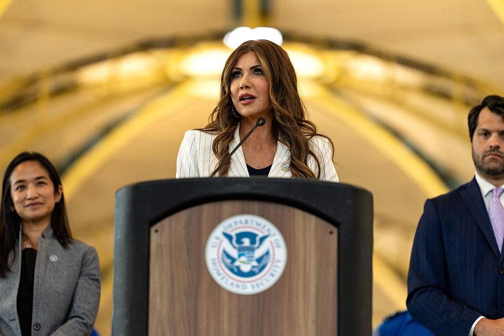 Secretary of Homeland Security Kristi Noem, flanked by Deputy Administrator of the Transportation Security Administration Ha McNeil and Adam Stahl, TSA Senior Official Performing the Duties of the Administrator, speaks during a news conference at Ronald Reagan Washington National Airport on July 8, 2025 in Arlington, Virginia.
