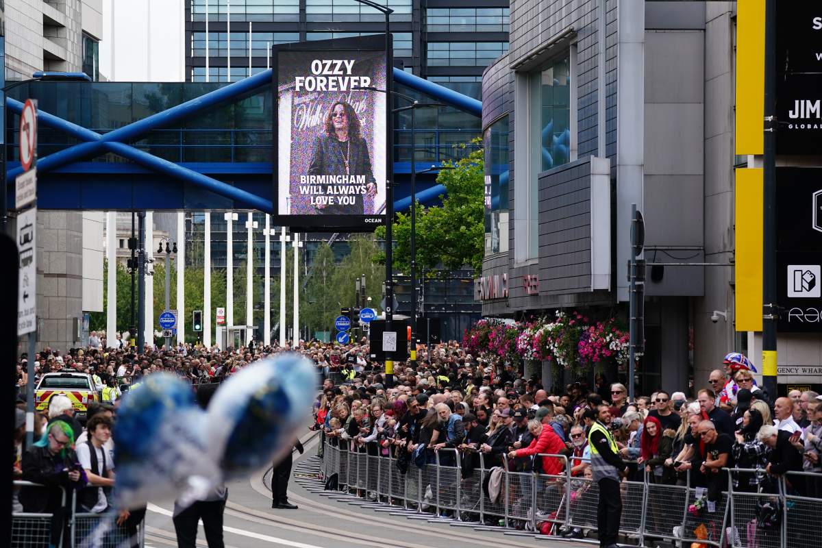 Fans on Broad Street in Birmingham in memory of Black Sabbath frontman Ozzy Osbourne, ahead of his body being brought back to his home city for a procession following his death last week aged 76. Picture date: Wednesday July 30, 2025.