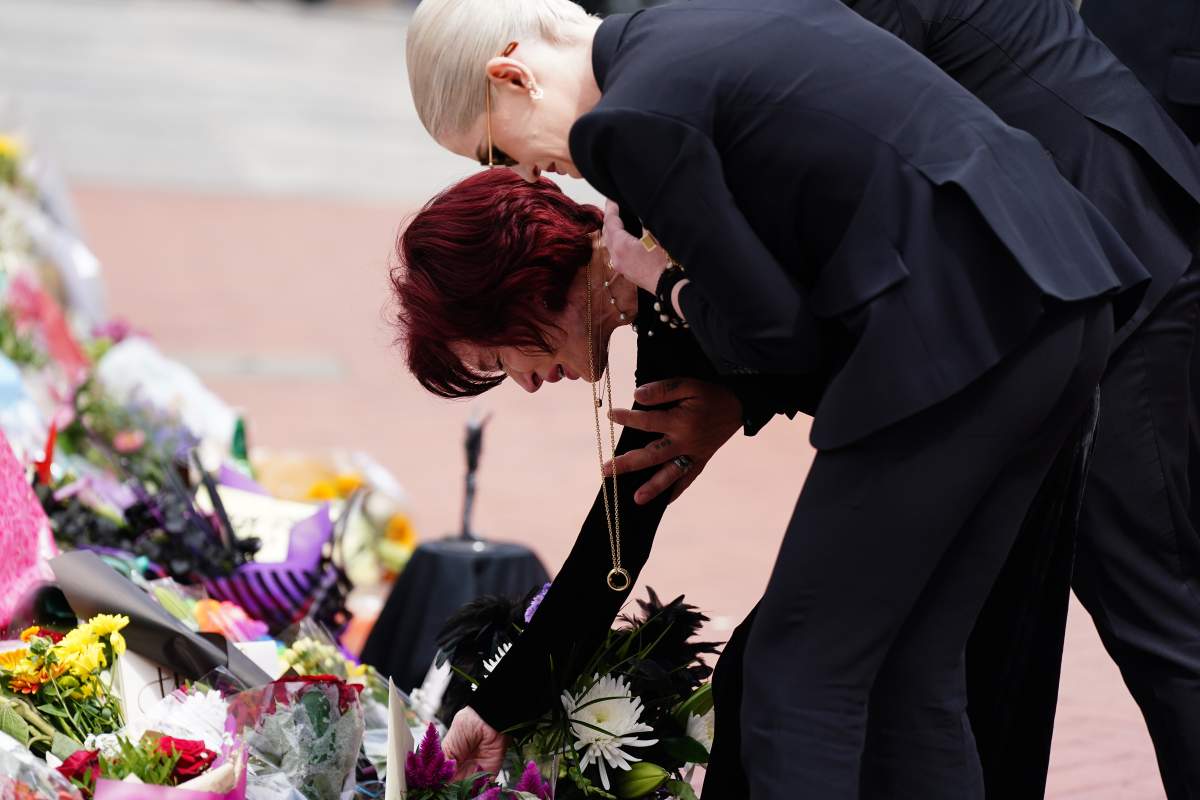 Sharon and Kelly Osbourne lay flowers at the Black Sabbath Bridge bench on Broad Street in Birmingham in memory of Black Sabbath frontman Ozzy Osbourne, as his body is brought back to his home city for a procession following his death last week aged 76.