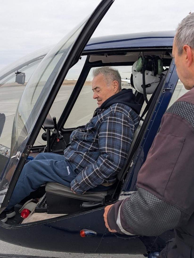 A resident goes on a helicopter ride.