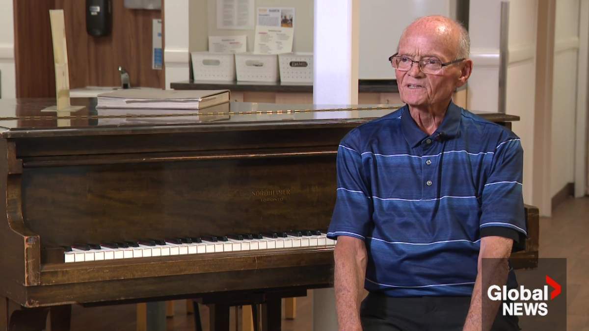 Covenant Care Foyer Lacombe hospice John Wintersgill patient with the piano he wants fixed up before he dies.