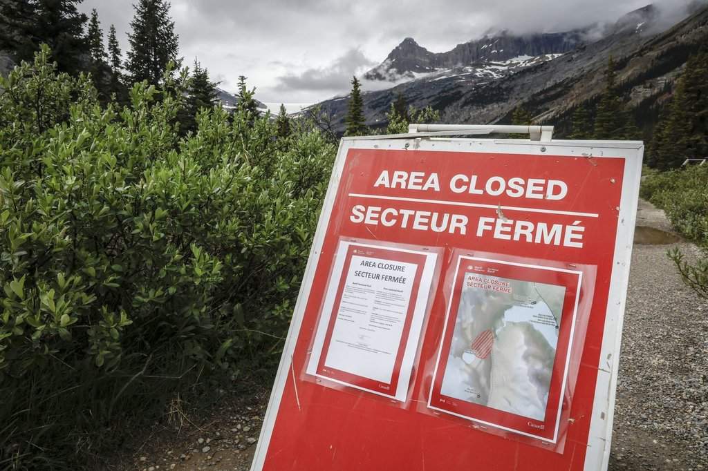 A closed sign blocks the trail to Bow Glacier Falls north of Lake Louise, Alta., in Banff National Park on Friday, June 20, 2025.