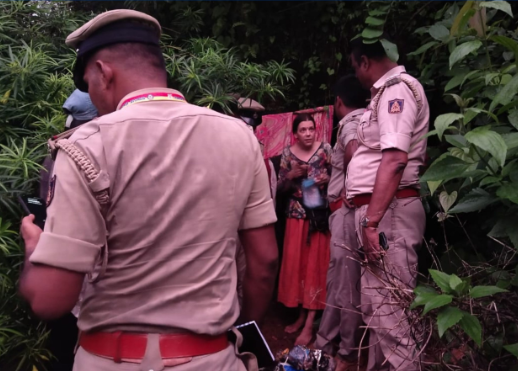 Indian policemen rescue Nina Kutina, 40, a Russian woman, from a cave in forest area of Ramtirtha hills in southern Indian state of Karnataka, Wednesday, July 9, 2025.