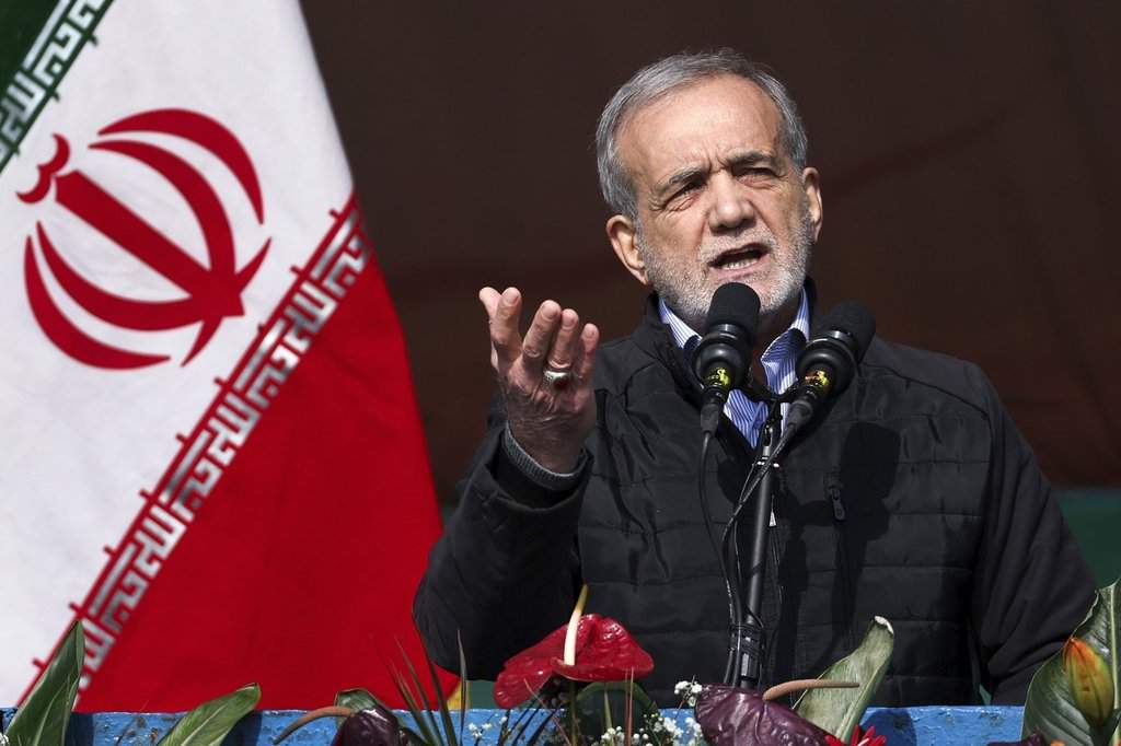 FILE - This photo released by the Iranian Presidency Office, President Masoud Pezeshkian speaks during a rally on Feb. 10, 2025, in Tehran, Iran. 